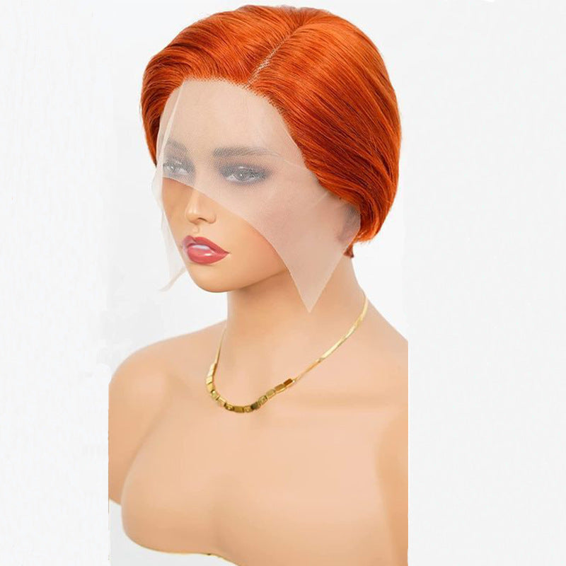 Pixie cut wig in bright orange on a mannequin