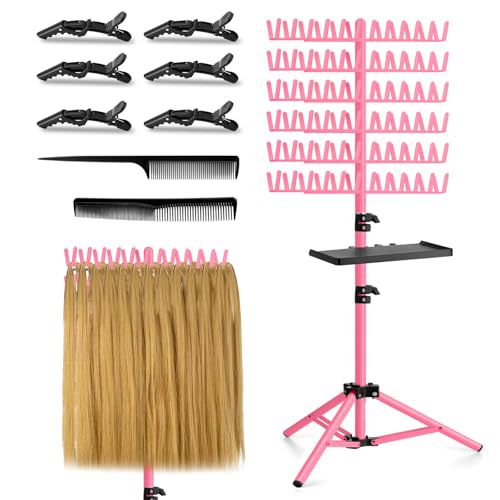 Pink hair rack stand with tray, clips and comb, holding hair