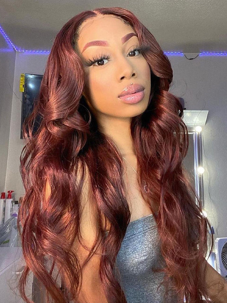 Model wearing a long reddish brown body wave glueless wig