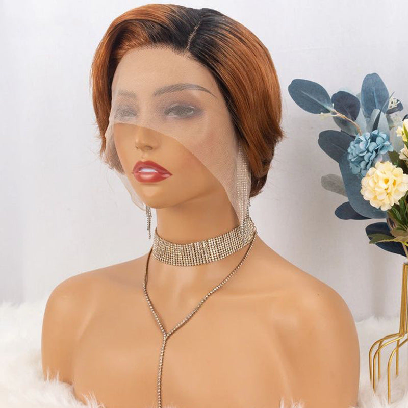 Pixie cut wig in copper ombre on a mannequin