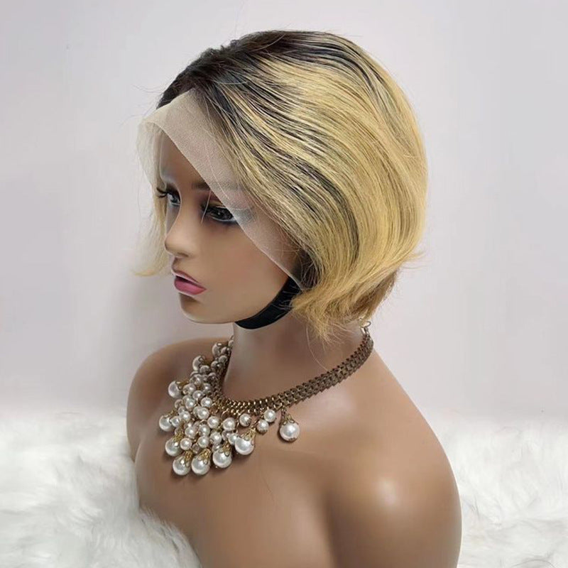 Pixie cut wig in blonde ombre with dark roots on a mannequin